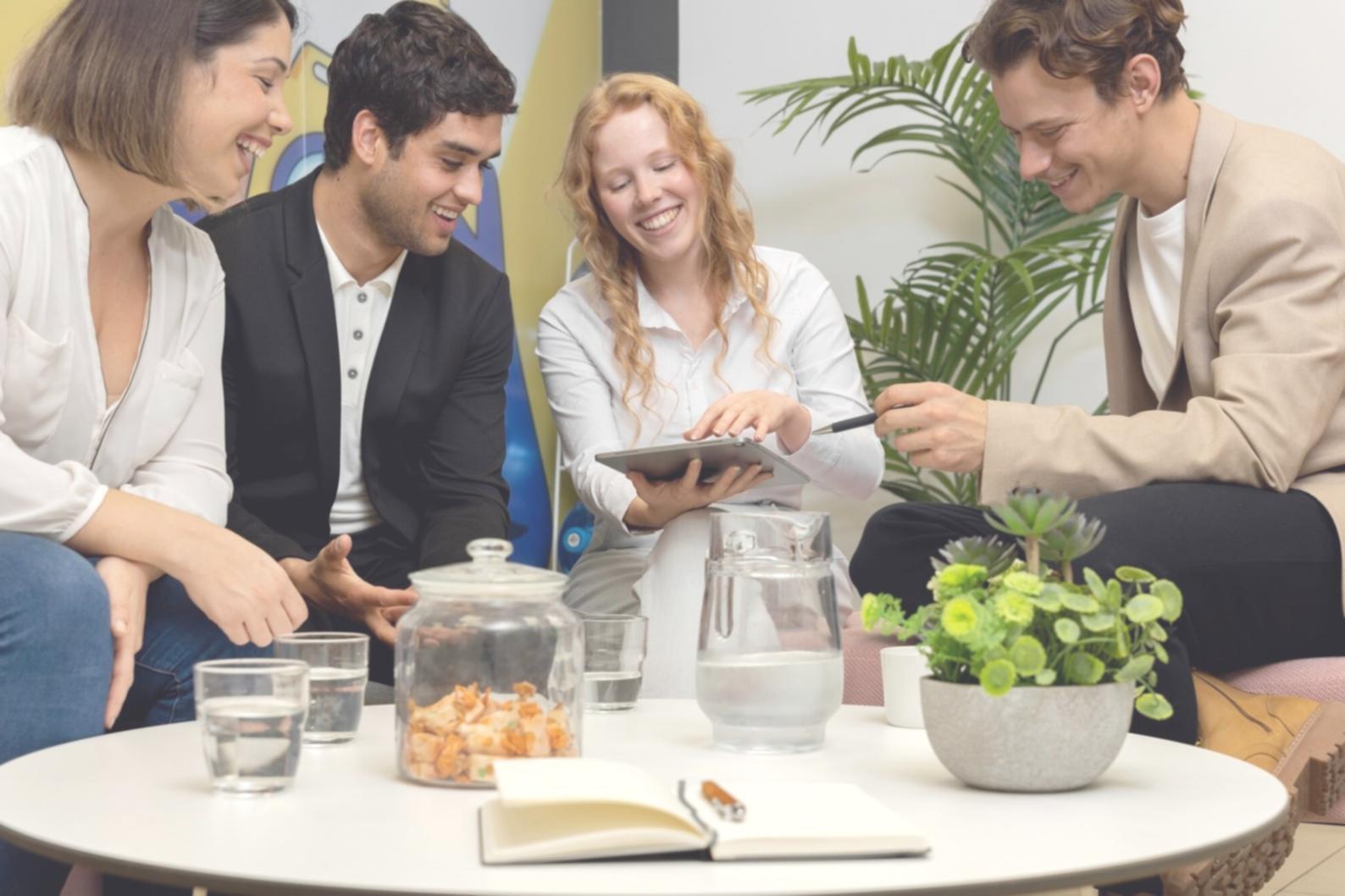 International students planning budget with calculator and notebooks