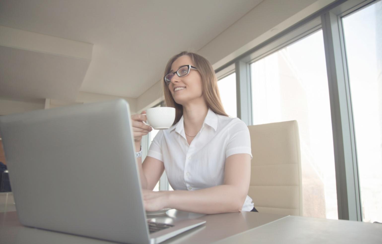 Professional business workspace with financial documents and technology